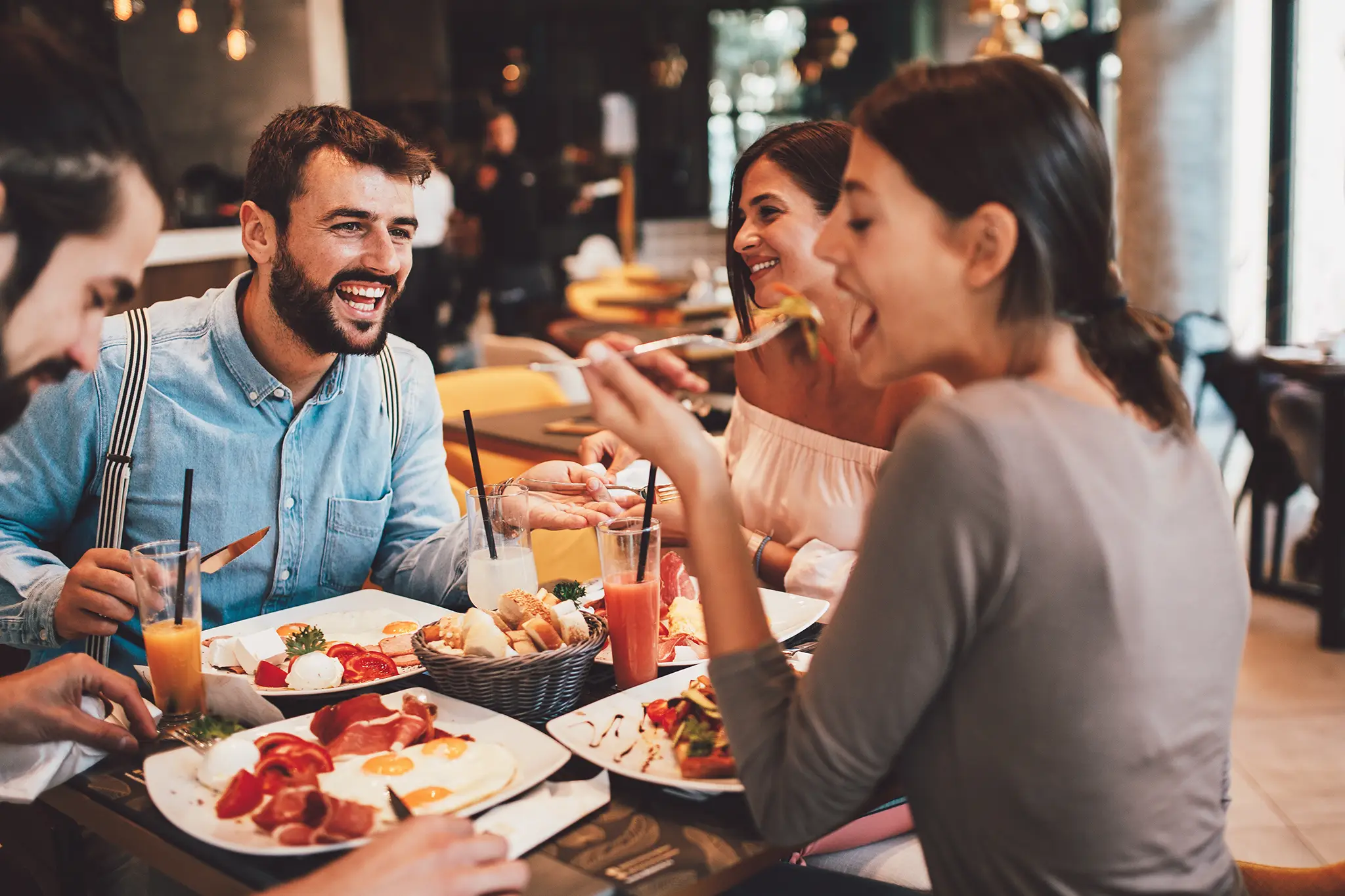 Group of happy friends in the restaurant.